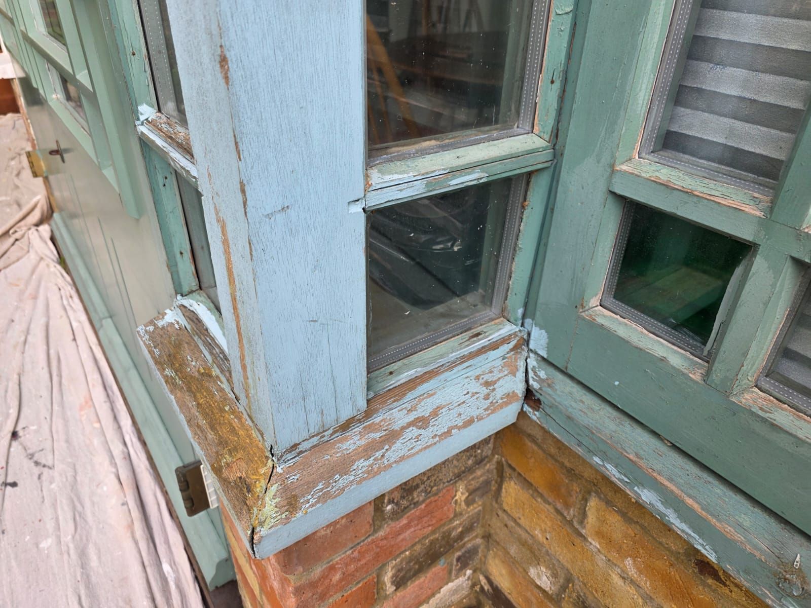Conservatory corner post before, with rot at the base