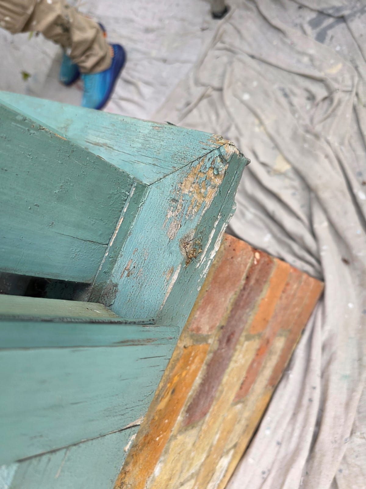 Corner timber before, with rot and loose paint