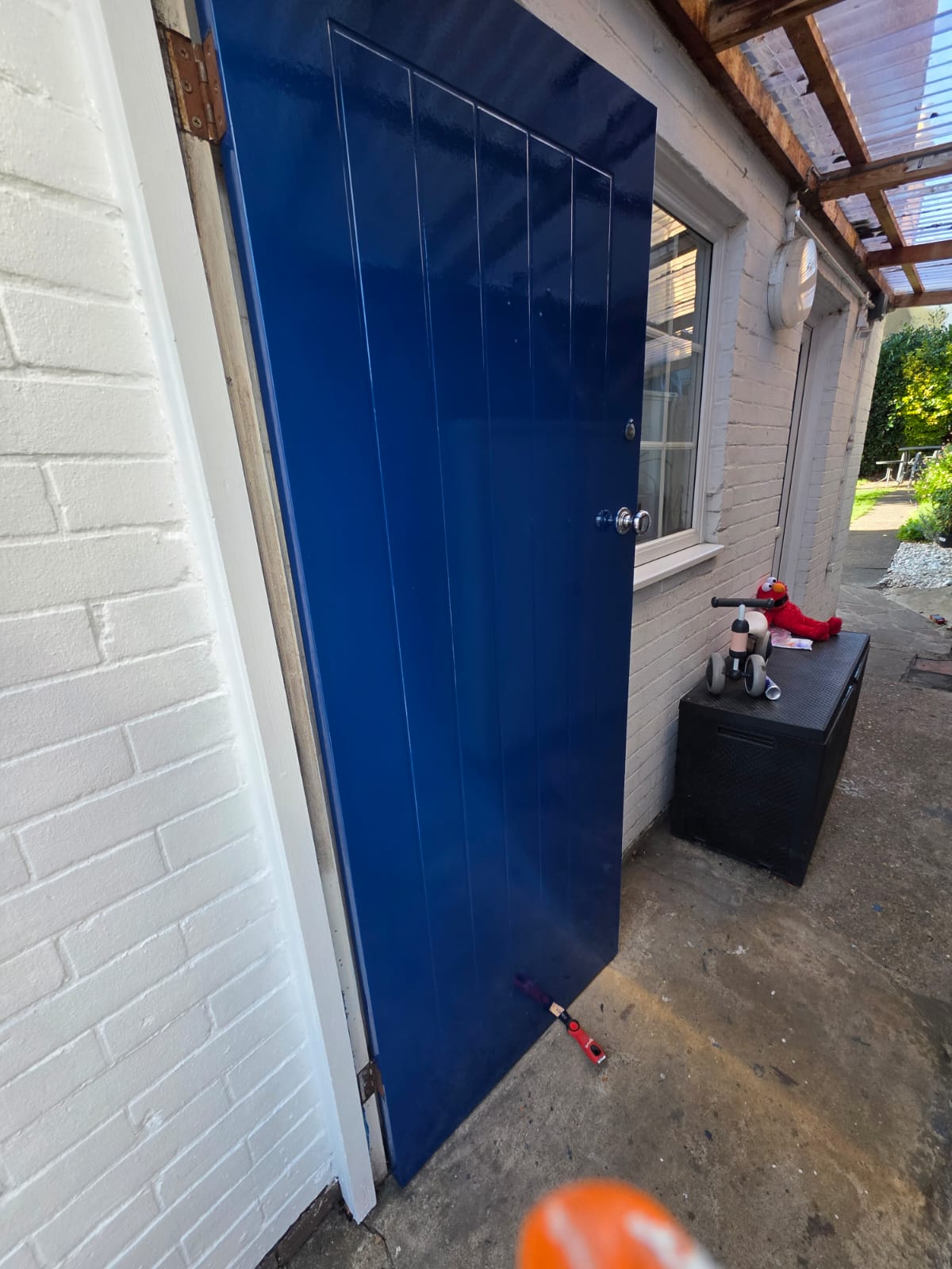 Side door finished in high-gloss blue