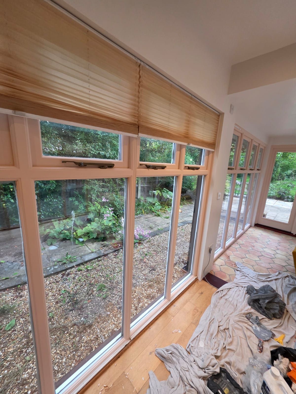 Garden room windows with blinds, during the job