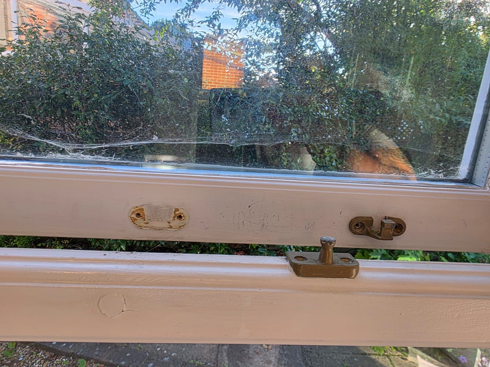 Garden room window and catches before