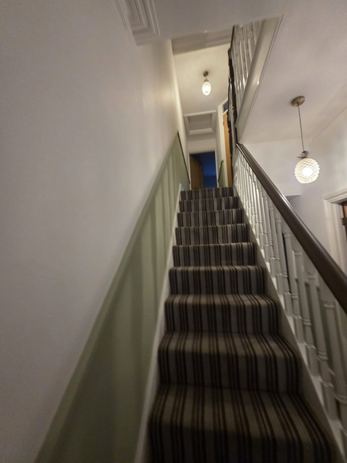 Staircase finished: sage green below the dado rail, white above