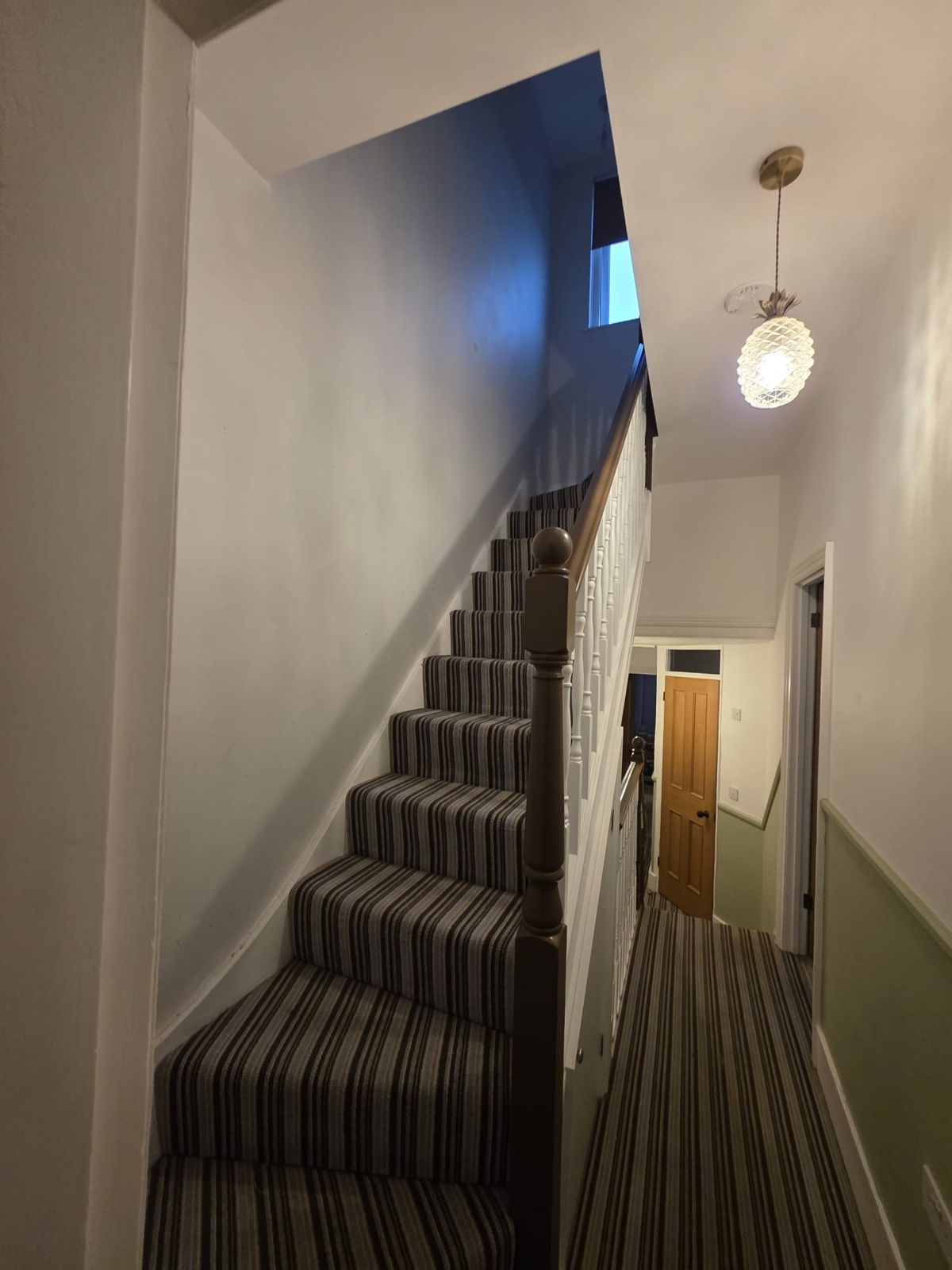 Stairs and landing in sage green and white
