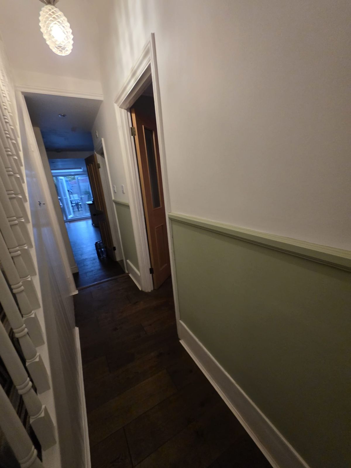 Downstairs hallway in sage green and white