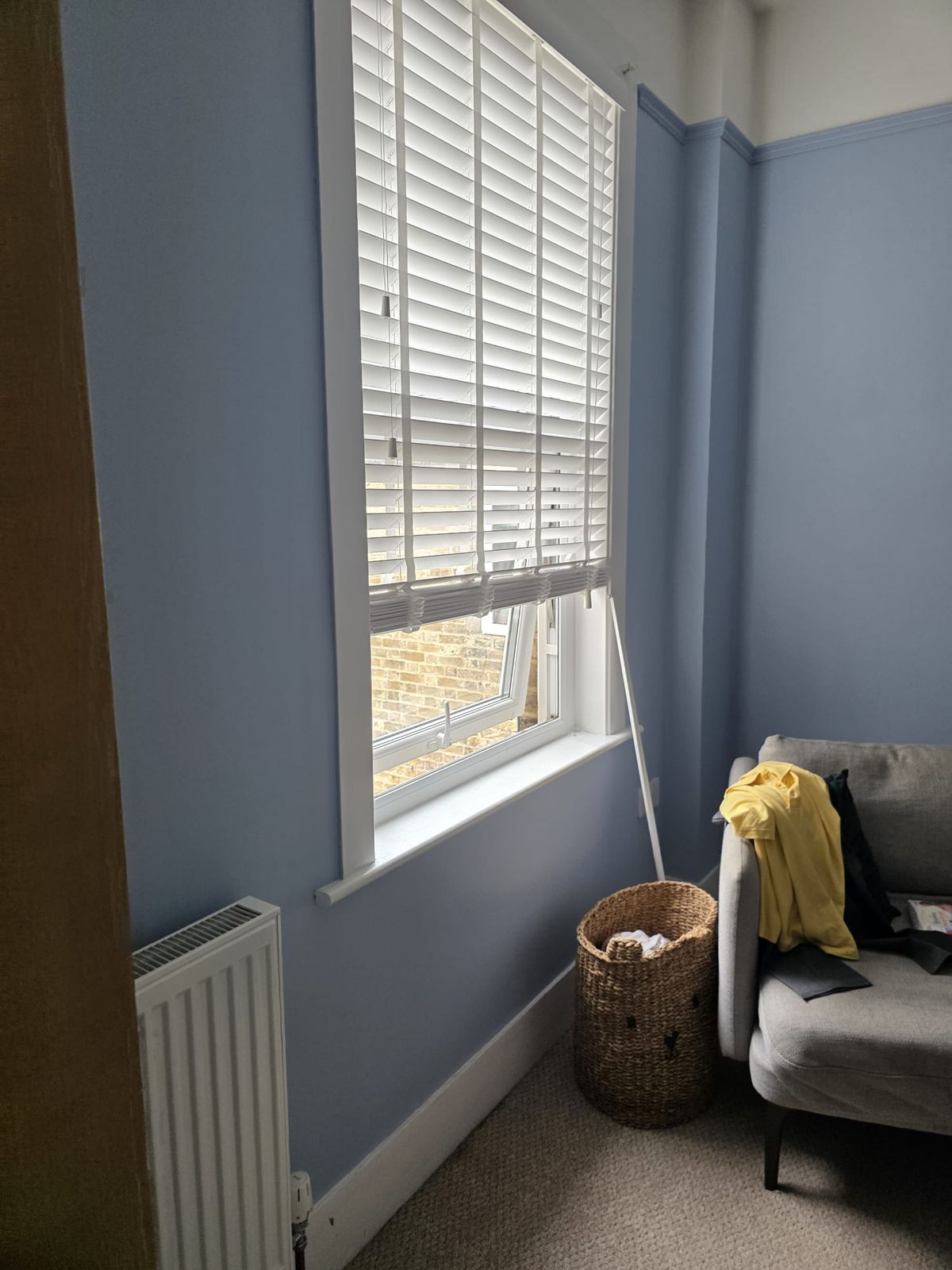 Bedroom window wall in soft blue
