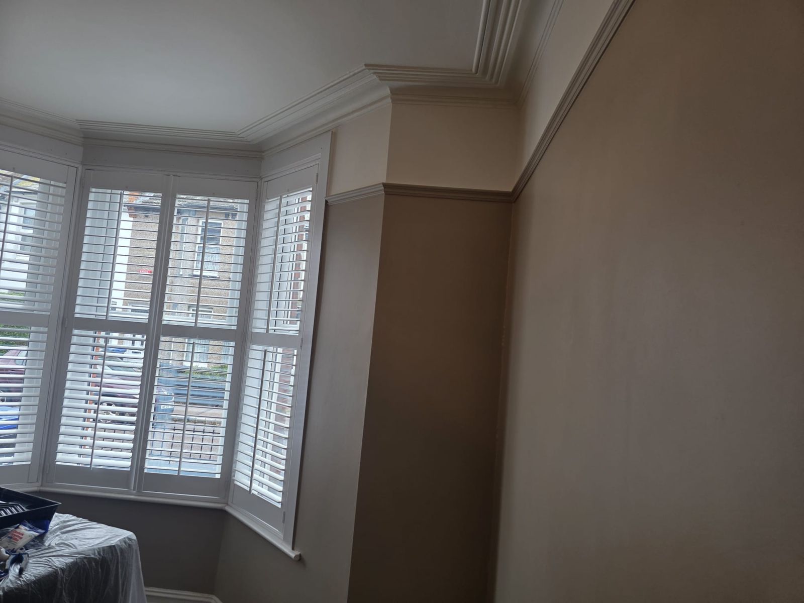 Bay-fronted room finished in a warm neutral