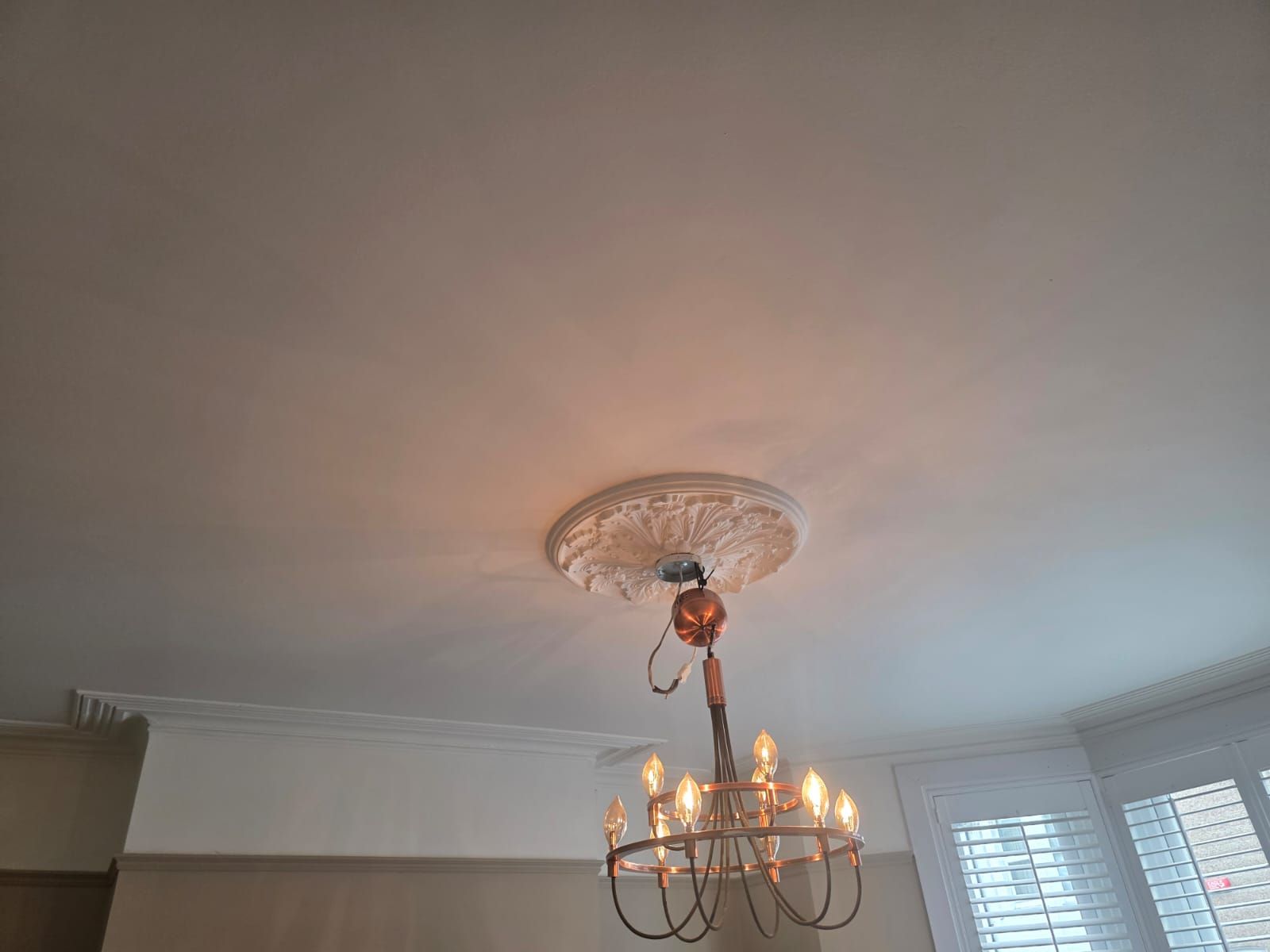 Ceiling, cornicing and ceiling rose painted white