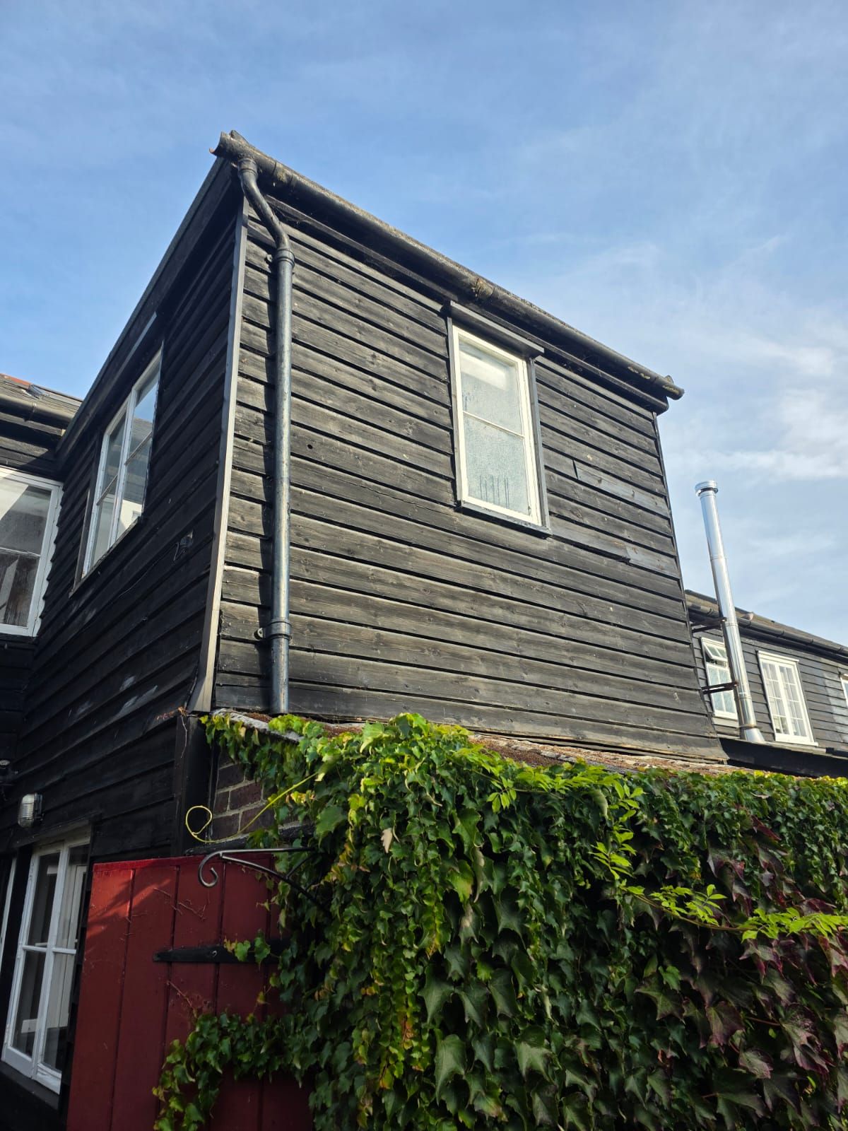 Rear gable in black weatherboard
