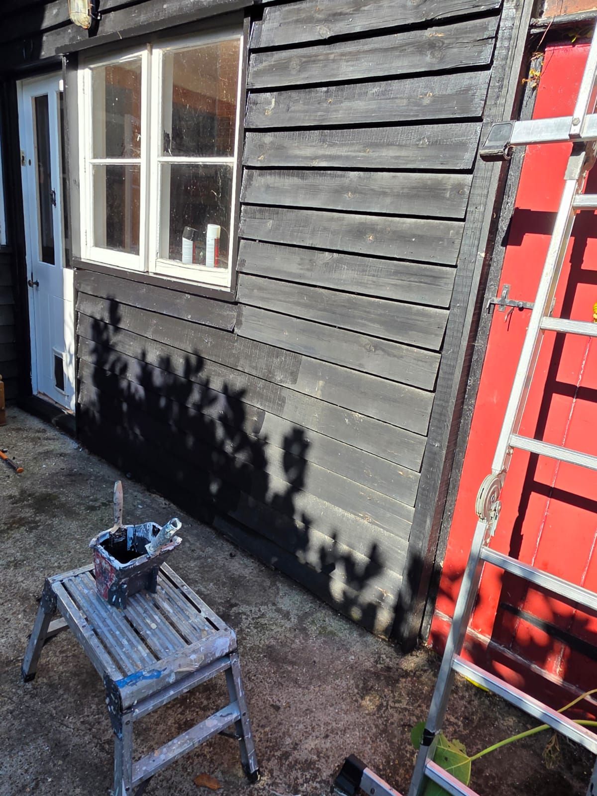 Rear boarding being prepared, with ladders up